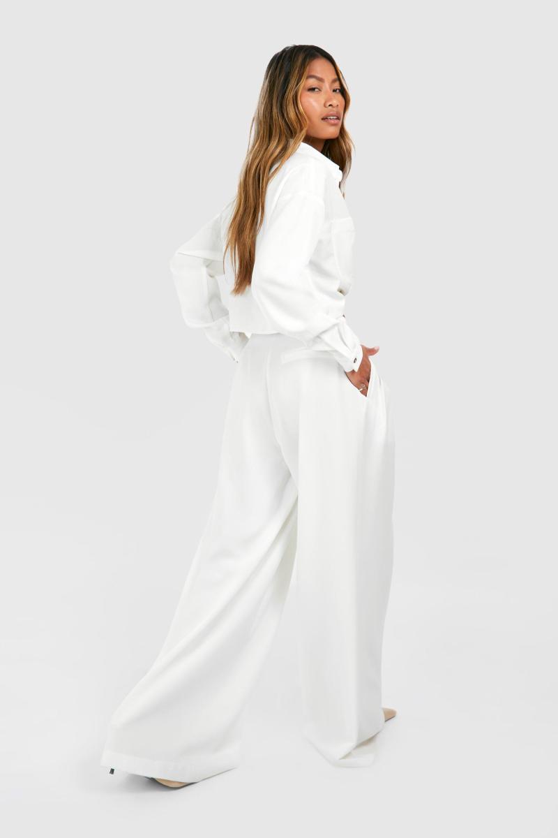 Широкі плісировані штани з низькою посадкою