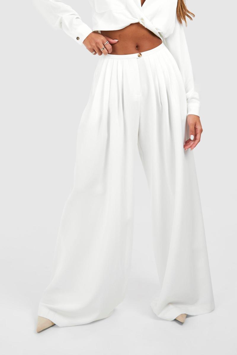 Широкі плісировані штани з низькою посадкою